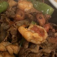 Gerardo'S Special (Fajita Mixta) · Tender strips of beef and chicken, with shrimp, sautéed with onions, bell peppers, and tomat...