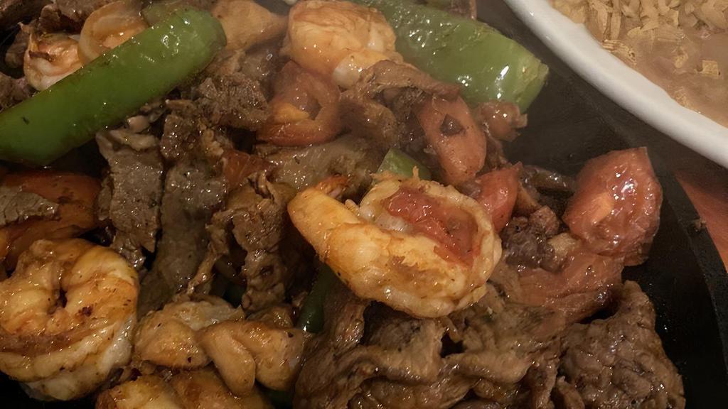 Gerardo'S Special (Fajita Mixta) · Tender strips of beef and chicken, with shrimp, sautéed with onions, bell peppers, and tomatoes.