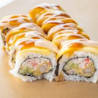 Mango Roll · shrimp tempura, cucumber ,crab inside with cream cheese and mango slices on top with eel sau...