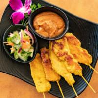 A-8 Chicken Satay (5)  Gluten Free · Chicken marinated with herbs, spices, and coconut milk. Grilled on the skewer and served wit...