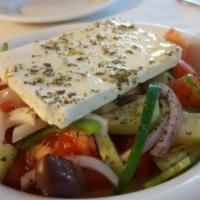 Greek Salad · Served with pita and house dressing.