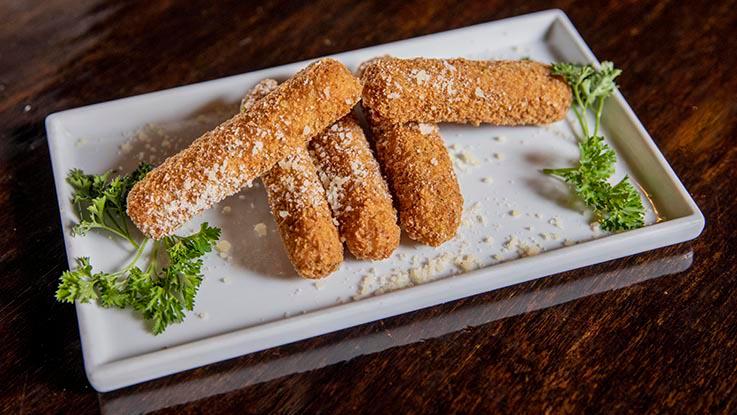Sticks · Elongated finest cheese breaded in italian bread crumbs served with marinara. Choose buffalo sticks for a tangy kick or bacon wrapped cheese sticks for even more flavor.