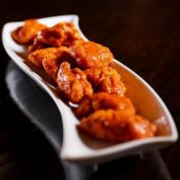 Boneless Wings · 10 pieces. All breast meat tossed in flavorful sauces. Choose from plain, tangy, BBQ, sweet ...