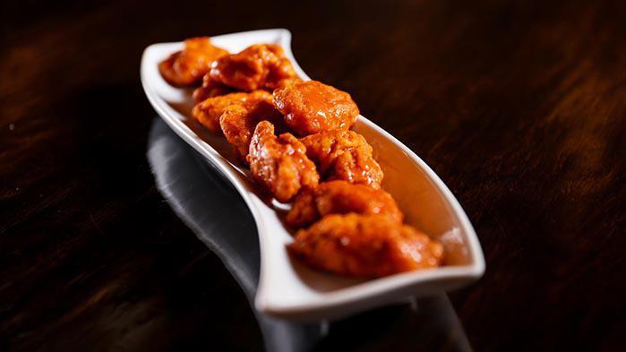 Boneless Wings · 10 pieces. All breast meat tossed in flavorful sauces. Choose from plain, tangy, BBQ, sweet Thai chili.