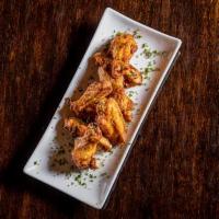 Buffalo Wings · Mild flavored chicken wings served with ranch dressing.