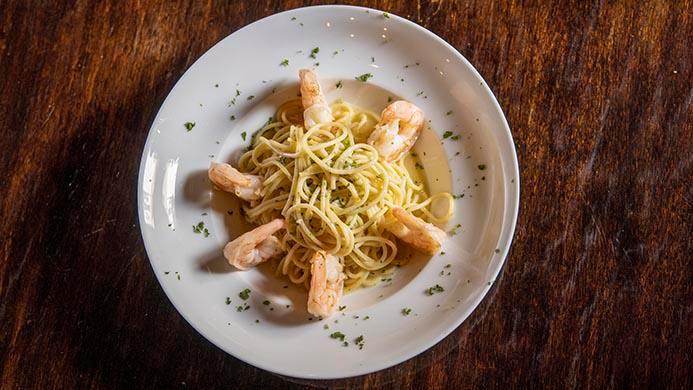 Shrimp Or Scallop Scampi · Spaghetti pasta with sautéed shrimp or seared scallops in a rich white wine garlic butter sauce.