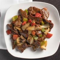 Dan'S Black Pepper Beef · Tender diced beef wok stir-fried with mushrooms, white onions, red peppers, and celery in ou...