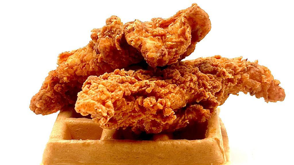 Fried Chicken & Waffles  · Two large fried chicken breast tenders served with a buttermilk waffle and syrup