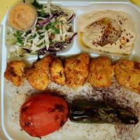 Chicken Shish Plate · Chicken breast pieces marinated with our mix of spices served with rice, salad, hummus, and ...