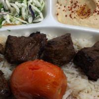 Filet Mignon Shish Plate · Tender beef marinated in special spices served with rice, salad. Hummus, and pita bread.