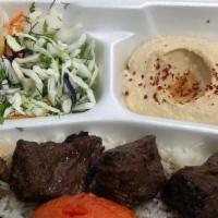 Lamb Shish Plate · Tender Lamb marinated in special spices served over a bed of rice, with sides of hummus, sal...