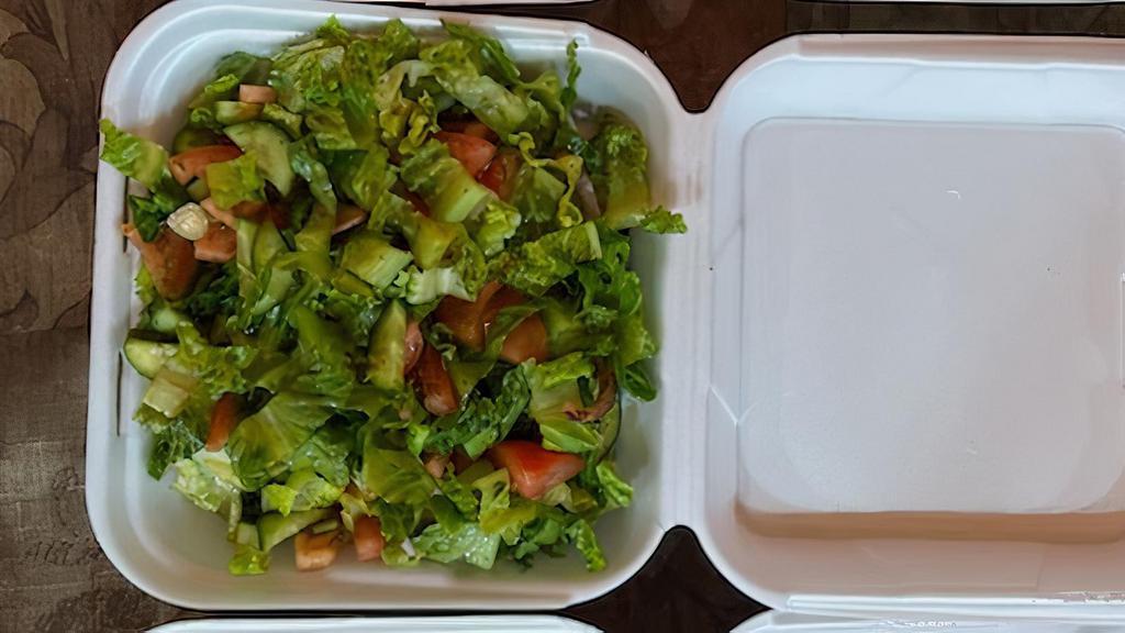 Green Salad · Organic Spring Mix-(A Blend of Tender Baby Greens), parsley, tomatoes, cucumbers, and served with a side of our homemade house dressing.