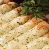 Cheese Bread · With garlic, Parmesan & Mozzarella + dipping sauce.