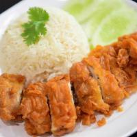 Crispy Chicken Over Rice · Deep fried chicken in batter served with sweet & sour sauce over rice.