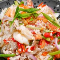 Yum Woonsen · Ground pork, shrimps with glass noodles tossed in chili, tomatoes, lime juice dressing over ...