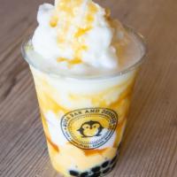 Caramel Milk Slush +B/Ep · A sweet milk ice blend with a drizzle around the cup. Drink includes boba an egg pudding.