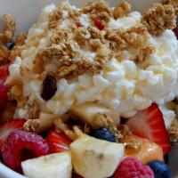 Cottage Cheese Fruit · A bowl of a variety of seasonal fruit topped with cottage cheese and granola. Large (20oz) o...