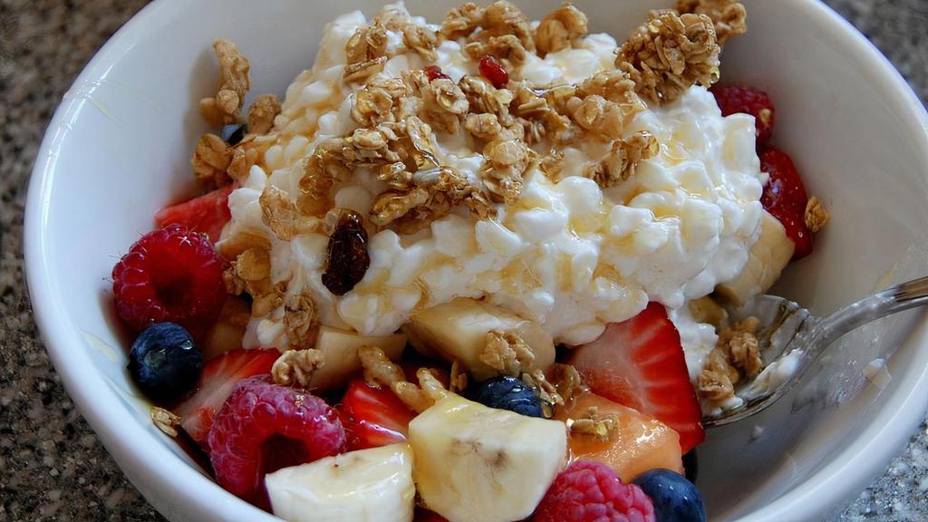 Cottage Cheese Fruit · A bowl of a variety of seasonal fruit topped with cottage cheese and granola. Large (20oz) or medium (16oz). Flavors: with granola, without granola.