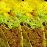 Beef Taco Special · Three homemade ground beef in a homemade hard shell tortilla with chopped lettuce and home c...