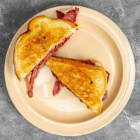 Pastrami Melt · House marinated and cut pastrami grilled on sourdough bread with swiss cheese.