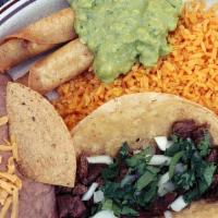 Combo Plate · A plate with one carne asada taco, two taquitos, homemade refried beans, homemade Mexican ri...
