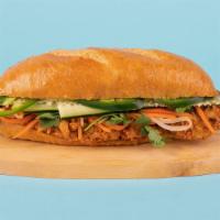 Fried Chicken Banh Mi · Crispy fried chicken with cucumber, jalapeno, cilantro, pickled carrots and sriracha mayo on...