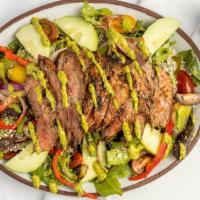 Steak Salad · Flank steak, spring arugula mix, heirloom tomatoes, cucumber, sautéed onions, bell peppers, ...