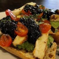Nicosia Avocado Toast · Fresh Hass avocado, grilled Halloumi cheese, cherry tomatoes, Kalimyrna fig and balsamic red...