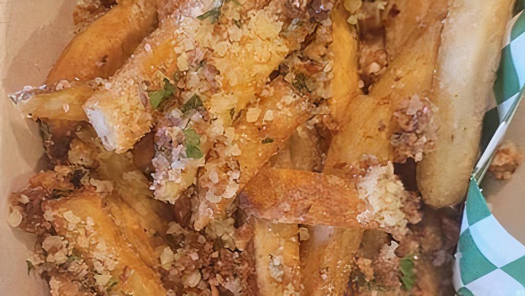 Garlic Fries · crispy garlic chips, parmesan, EVOO