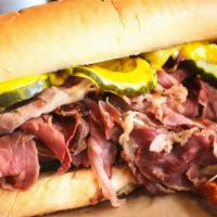 Our Famous Pastrami · Slowly marinated in our special au jus - piled high on a toasted french roll, with mustard a...