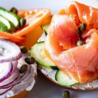 Lox Bagel · Bagel topped with Smoked Salmon, Tomato, Cucumber, Red Onion, Avocado, Capers, & Cream Cheese.