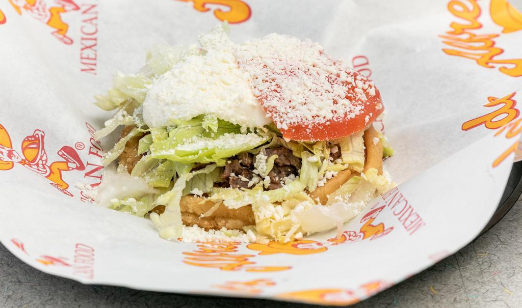 Sopes Plate · Two pieces. Choice of meat with beans, lettuce, cheese, and sour cream. Served with rice and beans.