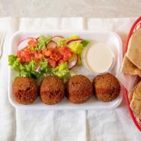 Falafel · A seasoned mixture of crushed garbanzo beans, fava beans, onions, garlic, and parsley.