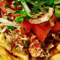 Chicken Shawarma Fries · Fries topped Chicken Shawarma,with parsley, onions, tomatoes, and garlic sauce.