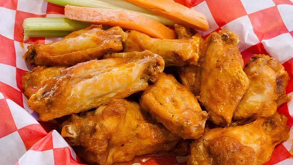 10 Piece Traditional Wings Bundle · Up to 2 wing sauce flavors Served with your choice of Coca-Cola Product.