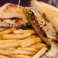 Turkey Club Sandwich · Smoked turkey breast, bacon, swiss cheese, red onioin, lettuce, tomato & mayo, served on gri...