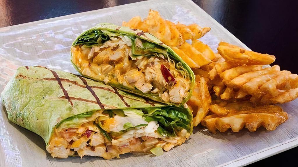 Jwi Wrap · Chicken Strips or Grilled Chicken tossed in your favorite JWI wing sauce, cheese, onion, lettuce, tomato & your choice of mayo or chipotle mayo
