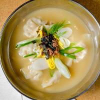Dumpling Soup (Manduguk) · Soup made by boiling dumplings in a beef  broth with beaten egg