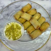 Karabich · 12 pieces of traditional Lebanese cookies made with semolina butter rosewater dough and fill...