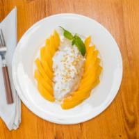 Mango Sticky Rice · In season sweet mangos sliced with sweet sticky rice.