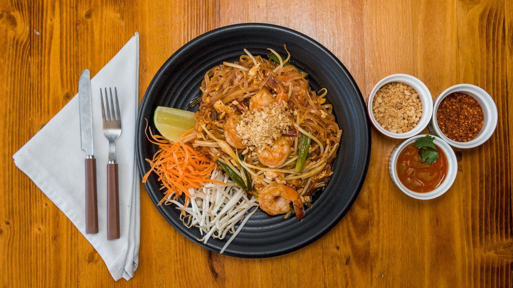 Pad Thai Noodles · Thin rice noodles pan-fried with egg, green onions, bean sprouts, peanuts, and tamarind sauce.