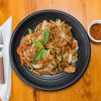 Drunken Noodles · Wide rice noodles sautéed with garlic, chili's, onions, bell peppers, tomatoes, and Thai bas...