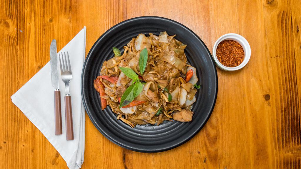 Drunken Noodles · Wide rice noodles sautéed with garlic, chili's, onions, bell peppers, tomatoes, and Thai basil.