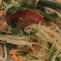 Green Papaya · Country style shredded raw papaya with crushed string beans, tomatoes, and peanuts in spicy ...