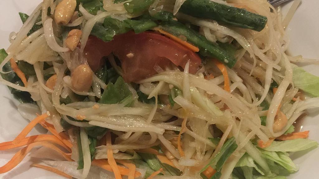 Green Papaya · Country style shredded raw papaya with crushed string beans, tomatoes, and peanuts in spicy lime dressing.
