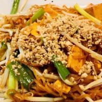 Pad Thai · Delightful chantaboon noodle dish with bean sprouts, green onions, and egg, topped with crus...