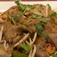 Drunken Noodles (Spicy Noodles) · Spicy pan-fried flat rice noodles with garlic, Thai chilies, bell peppers, bean sprouts, oni...