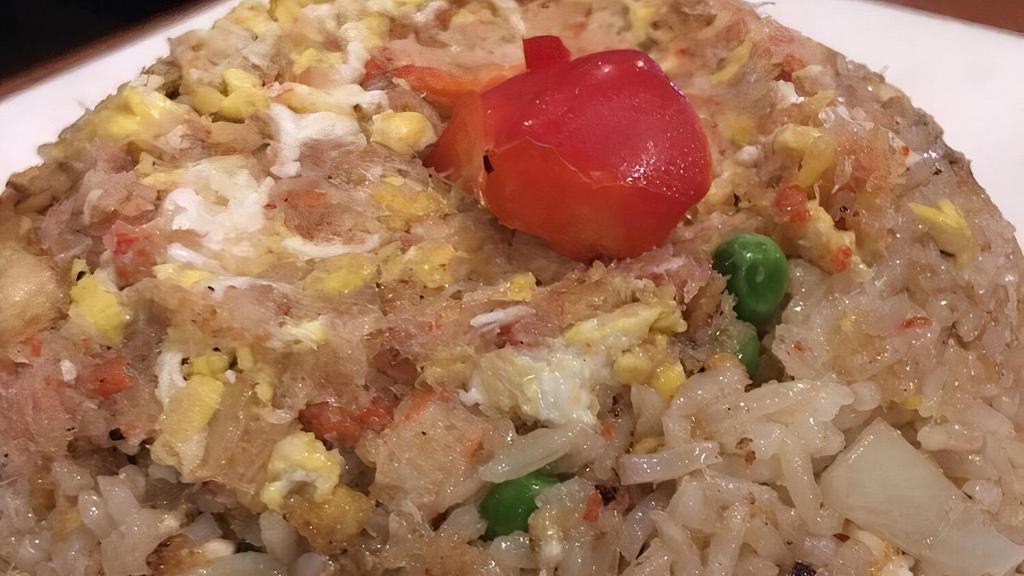 Crab Meat Fried Rice · Traditional Thai fried rice with minced crab meat, onions, scallions, tomatoes, peas, carrots, and egg.
