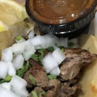 Asada Taco · A grilled taco with delicious asada, chicken, or juicy al pastor, topped with cilantro and o...