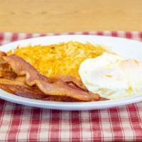Two Eggs Your Way Combo · two eggs any style, Choice of bacon or sausage and hash browns. toast